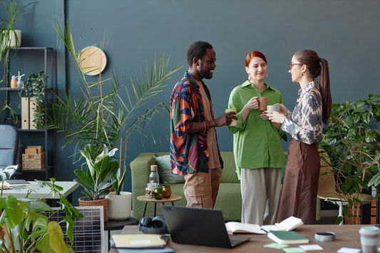 Three poeple talking about work with Well Life