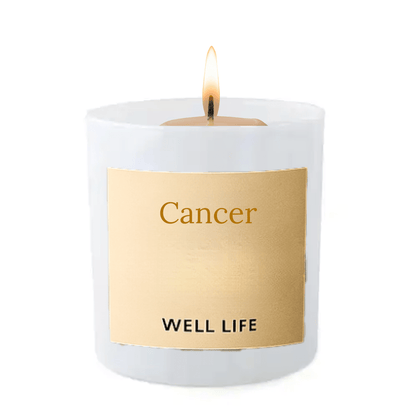 Candle with a 'Cancer' label on a gold tag, featuring the brand 'Well Life'.