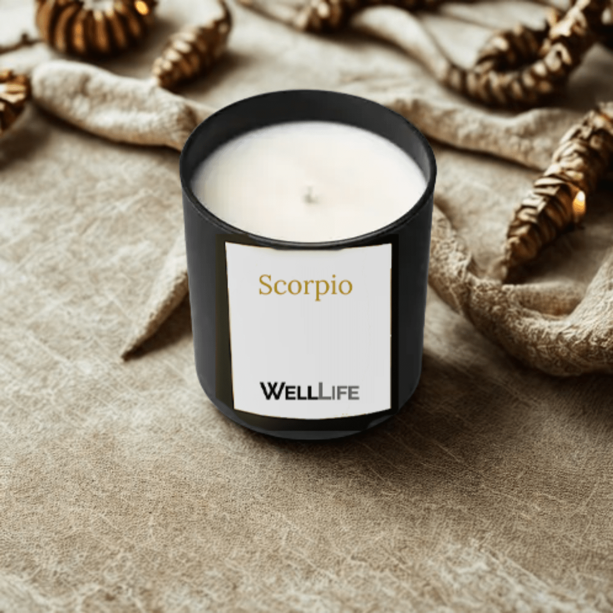 Candle labeled 'Scorpio' by WELL LIFE on a textured surface with decorative elements.