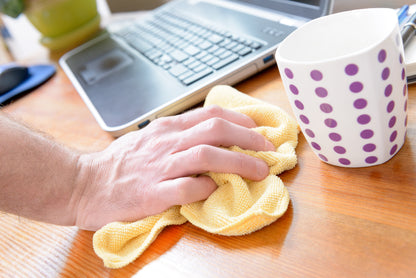 Cleaning a desk with solution from Well Life All Purpose Cleaning Tablets. Just mix with water. Save the environment by not shipping water. Save money on this household essential.